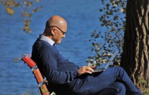 man outside surfing the internet
